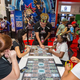 Young duelists play Yu-gi-oh at a public tournament.